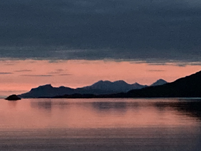 sunset on Loch Moidart with Eigg to the left and Rum to the right in the background
