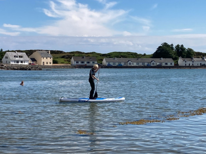 Jean on paddle board at Port Ellen